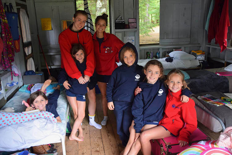 A counselor in the cabin with campers